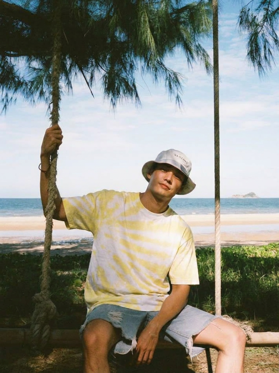 wyper tie dye custume taking a picture wearing golden ray tshirt in a moroccan beach 